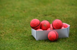 File: A box of used pink cricket balls are pictured on a pitch. AFP/Paul Ellis