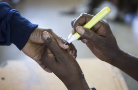 A voter gets a finger inked at a polling station on May 8, 2019 during the legislative and presidential elections in South Africa.