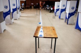 File: Tape of the IEC demarcates a polling station. AFP/Rodger Bosch