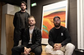 Obvious Artists collective members pose in front of the first print from their "Mind-to-Image" project. AFP/Thomas Samson
