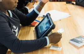 An IEC official scans the identity card of a voter. AFP/Rajesh Jantilal