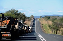 File: A line of trucks along the N4 highway. Leon Sadiki/Bloomberg via Getty Images