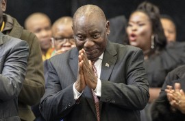 President of the African National Congress (ANC) Cyril Ramaphosa (C) gestures after he was announced President after members of Parliament voted during the first sitting of the New South African Parliament in Cape Town on June 14, 2024. 