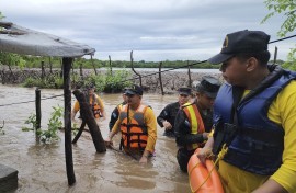 firefighters carrying out rescue work in a flooded area in Nacaome, Valle department, Honduras. AFP/Honduran Firefighters