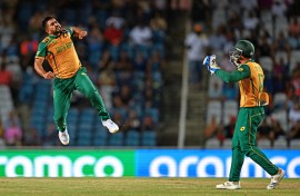 Tabraiz Shamsi (L) celebrates after the dismissal of Afghanistan's Karim Janat (out of frame) during the ICC men's Twenty20 World Cup 2024 semi-final cricket match between South Africa and Afghanistan. AFP/Chandan Khanna