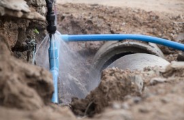 File: An exposed burst water pipe spraying water.GettyImages/24d8bd43_811