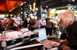 DJ Wika performs for seniors at the shopping centre in Warsaw. AFP/Sergei Gapon
