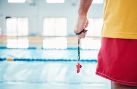 File: A lifeguard at a swimming pool. GettyImages/PeopleImages