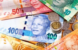 File: South African banknotes with Five Rand and Two Rand coins. GettyImages/RapidEye