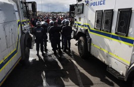 File: Police officers seen at a protest near Cape Town. AFP/Rodger Bosch