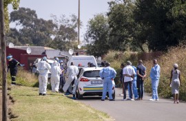 File: Police and forensic officers at a crime scene. AFP/Emmanuel Croset