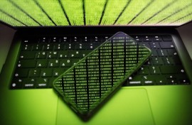 Binary code is being displayed on a smartphone and on a computer screen in Chania, Greece, on August 9, 2024.