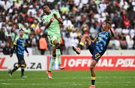 Taahir Goedeman of Cape Town City gets to the ball ahead of Thalente Mbatha of Orlando Pirates during the DStv Premiership 2023/24 Game at Cape Town Stadium 