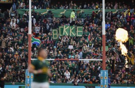 South African supporters hold up placards. AFP/Phill Magakoe
