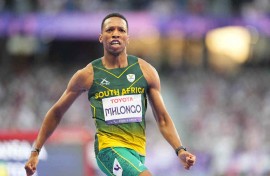 Mpumelelo Mhlongo of South Africa celebrates winning gold in Men's 100m - T44 Final. lrik Pedersen/NurPhoto via AFP