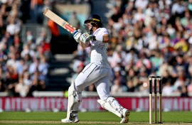 England's Jamie Smith watches the ball after playing a shot on day three of the third cricket test match between England and Sri Lanka. AFP/Glyn Kirk