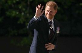 Britain's Prince Harry, Duke of Sussex waves as he arrives to attend a ceremony marking the 10th anniversary of the Invictus Games. AFP/Justin Tallis