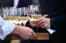 The first batch of wine is handed out to guests at the vineyards of Domaine Evremond in Chilham. AFP/Ben Stansall