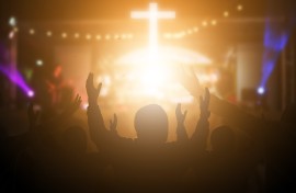 File: People listening to worship music. GettyImages/arkira
