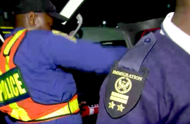 SAPS and immigration officer