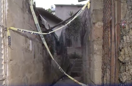 Crime scene tape at one of the houses in Lusikisiki. 