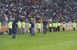 Unruly fans invaded the pitch during the first half of the game. BackpagePix/Deryck Foster