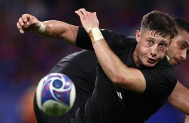 New Zealand's scrum-half Cam Roigard passes the ball out of a scrum. AFP/Anne-Christine Poujoulat