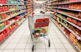File: A shopping cart in the middle of a section of canned and dried products. Nicolas Guyonnet/Hans Lucas via AFP