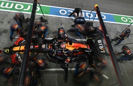Team mechanics work on the car of Red Bull Racing's Dutch driver Max Verstappen in the pits. AFP/Lilian Suwanrumpha