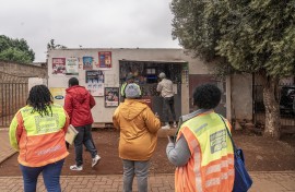 Officials about to conduct an inspection on a spaza shop in Naledi, Soweto. AFP/Shiraaz Mohamed