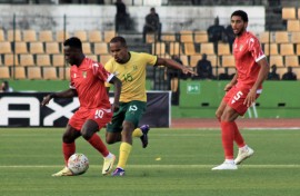 Congo players and Bafana's Iqraam Rayners. BackpagePix/Louvila Fonseca Brice Rogatien
