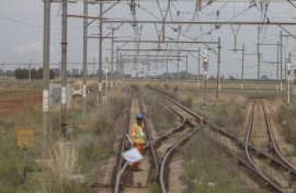 A worker prepares to signal on the train tracks on the central corridor rail freight line. Guillem Sartorio/Bloomberg via Getty Images