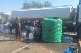 Joburg residents fetching water from a roaming tank. eNCA/Bafedile Moerane