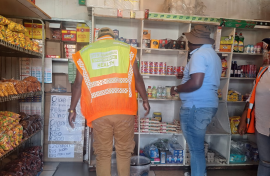 Spaza shop being inspected in Soweto.