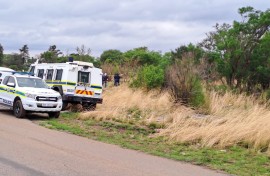 Police officers waiting for the illegal miners to resurface. eNCA/Bafedile Moerane