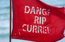 File: A red flag, indicating unsafe swimming conditions and warning for rip current, is seen on a beach. AFP/Jaydee Lee Serrano