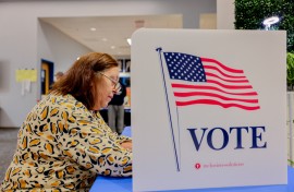 A voter fills out her ballot at a polling station in Ashburn, Virginia, on November 5, 2024. Voters in Ashburn, Virginia, participate in the 2024 U.S. Election, casting their ballots in a highly anticipated race between Kamala Harris and Donald Trump.