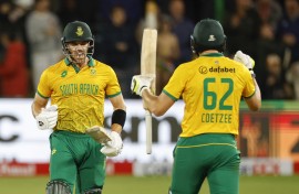South Africa's Tristan Stubbs (L) celebrates scoring the winning runs as South Africa's Gerald Coetzee (R) looks on during the second T20 international cricket match between South Africa and India. AFP/Phill Magakoe