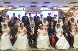 Couples posing for a group wedding photo in a restaurant in Hong Kong. AFP/Jaixin Lu
