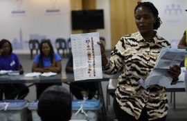 An Electoral Commission of Namibia (ECN) official displays a marked ballot at a polling station. AFP/Simon Maina