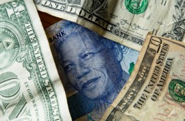 A rand to the dollar currency exchange concept image. GettyImages/Matthew de Lange