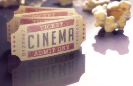 Cinema tickets and popcorn, computer illustration.