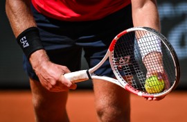 File: A tennis player with a tennis racket and ball. Matthieu Mirville/DPPI via AFP 
