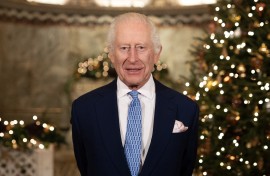 Britain's King Charles III smiles during the recording of his Christmas message. AFP/Aaron Chown