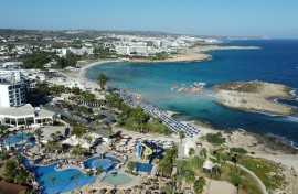 Beachgoers at Nissi Beach in Cyprus' southern coastal resort town of Ayia Napa. AFP/Etienne Torbey