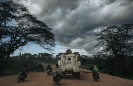 A MONUSCO armed vehicle drives along the Beni-Kasindi Road. AFP/Alexis Huguet