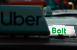 File: Uber and Bolt logos are seen on vehicles. Jakub Porzycki/NurPhoto via AFP
