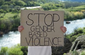 File: A sign calling for gender-based violence to be stopped. GettyImages/Liudmila Chernetska