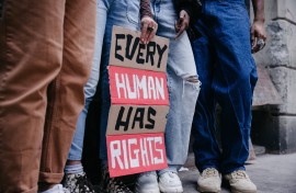 File: Group of people marching for human rights. GettyImages/Leo Patrizi