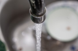 File: An open tap with water flowing from it. Romain Costaseca/Hans Lucas via AFP